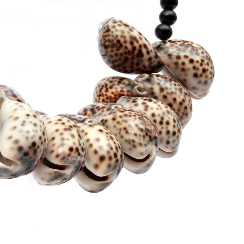The Tiger Cowrie Necklace Black Wood on Stand home deco bohosaninterior 