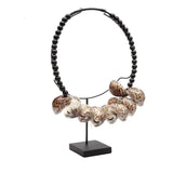 The Tiger Cowrie Necklace Black Wood on Stand home deco bohosaninterior 